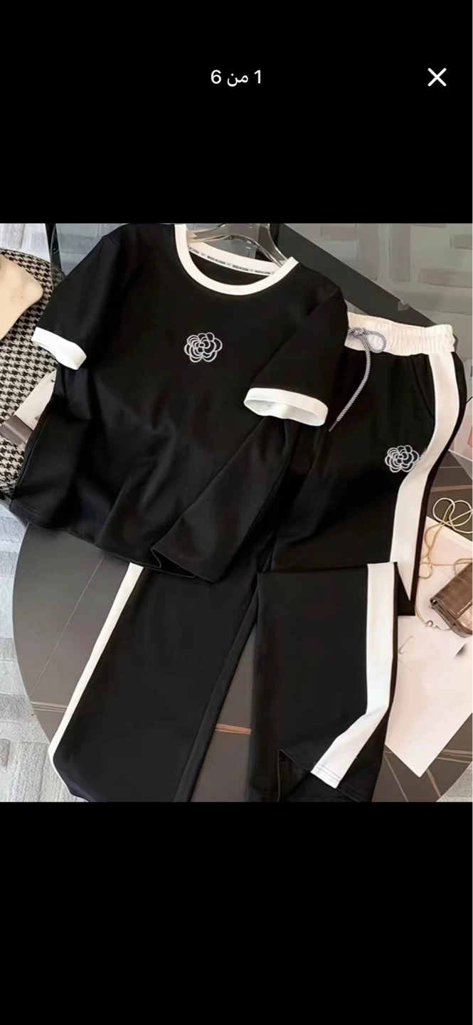 Black Two-Piece T-Shirt and Pants Set with Floral Logo