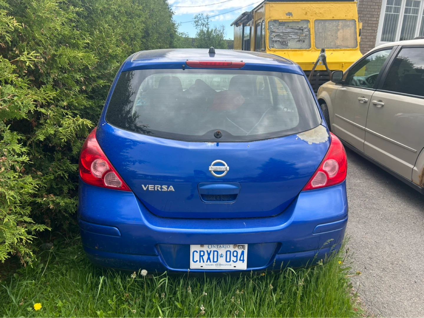Blue Nissan Versa Hatchback - photo 4