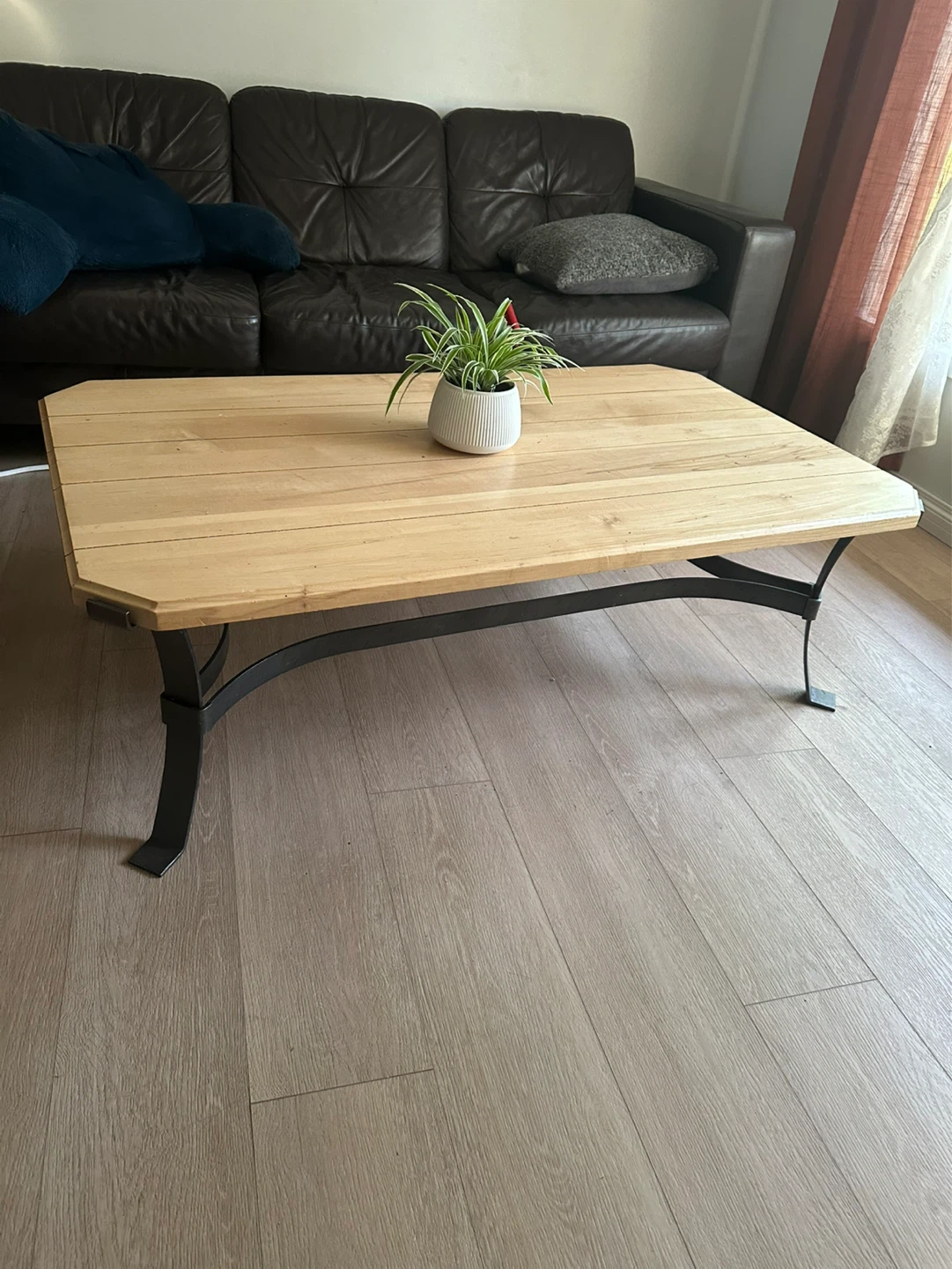 Wooden coffee table with metal legs