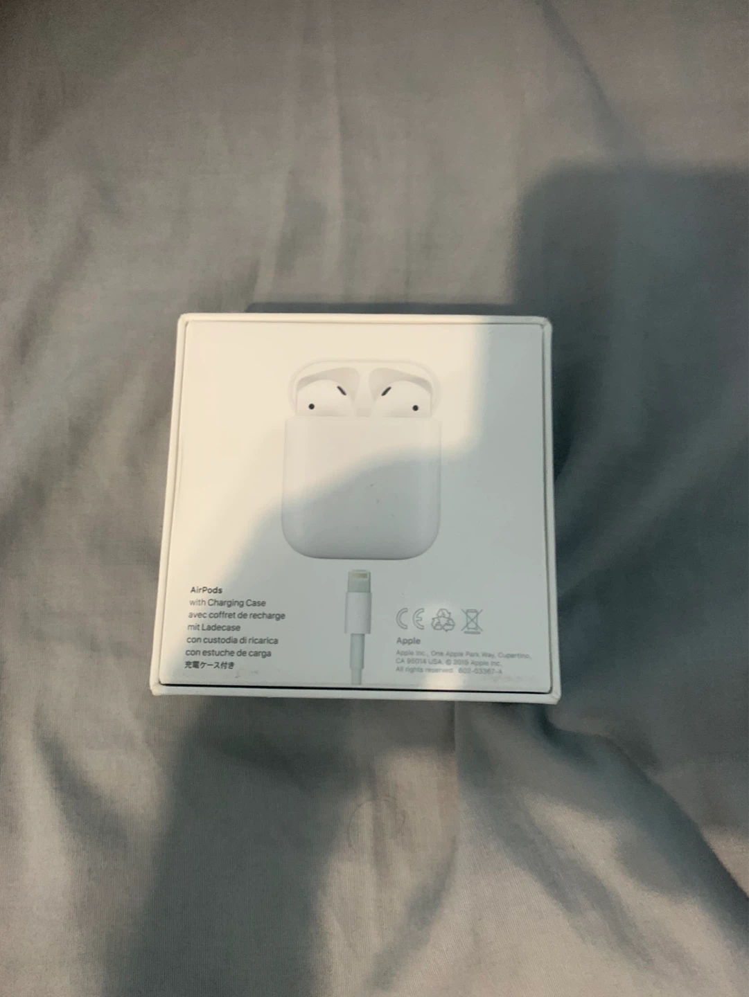 Apple AirPods (2nd Generation) with Charging Case - photo 2