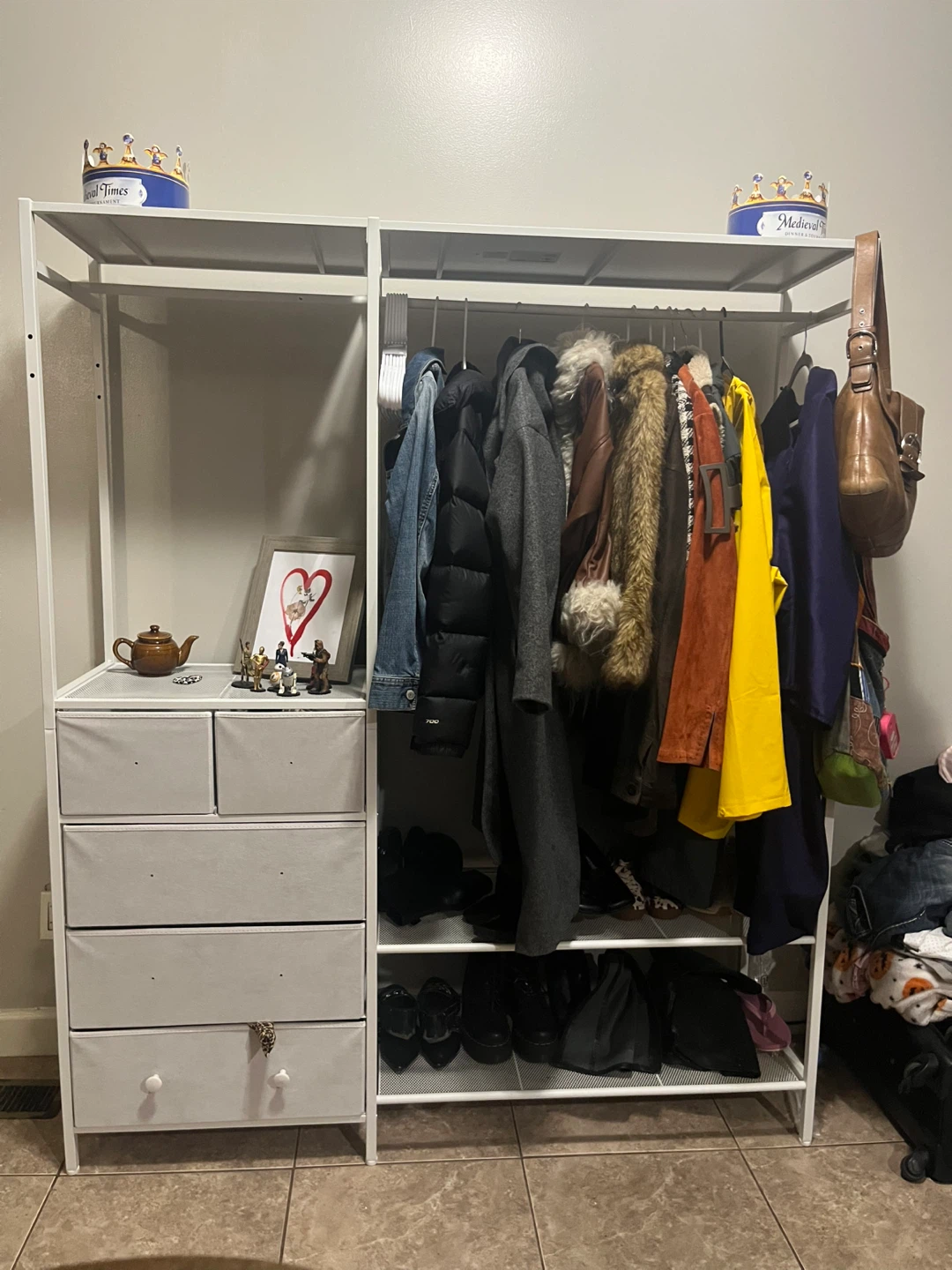 White metal clothing rack with drawers