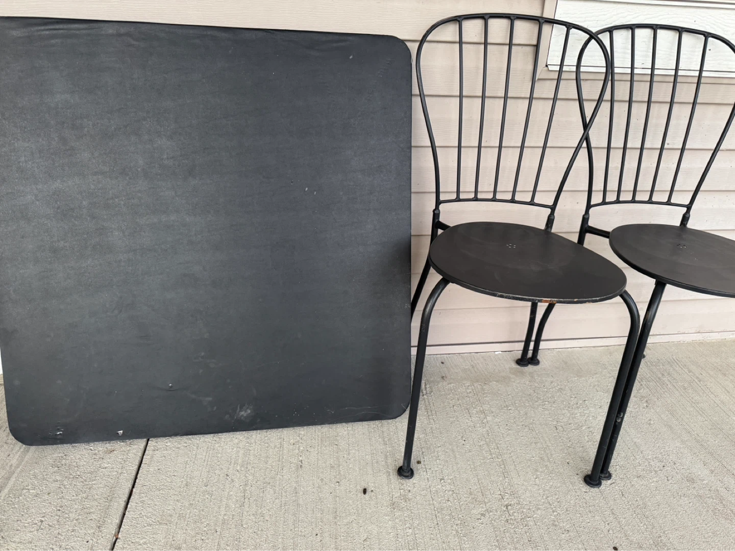 Black Rectangular Table and Two Chairs