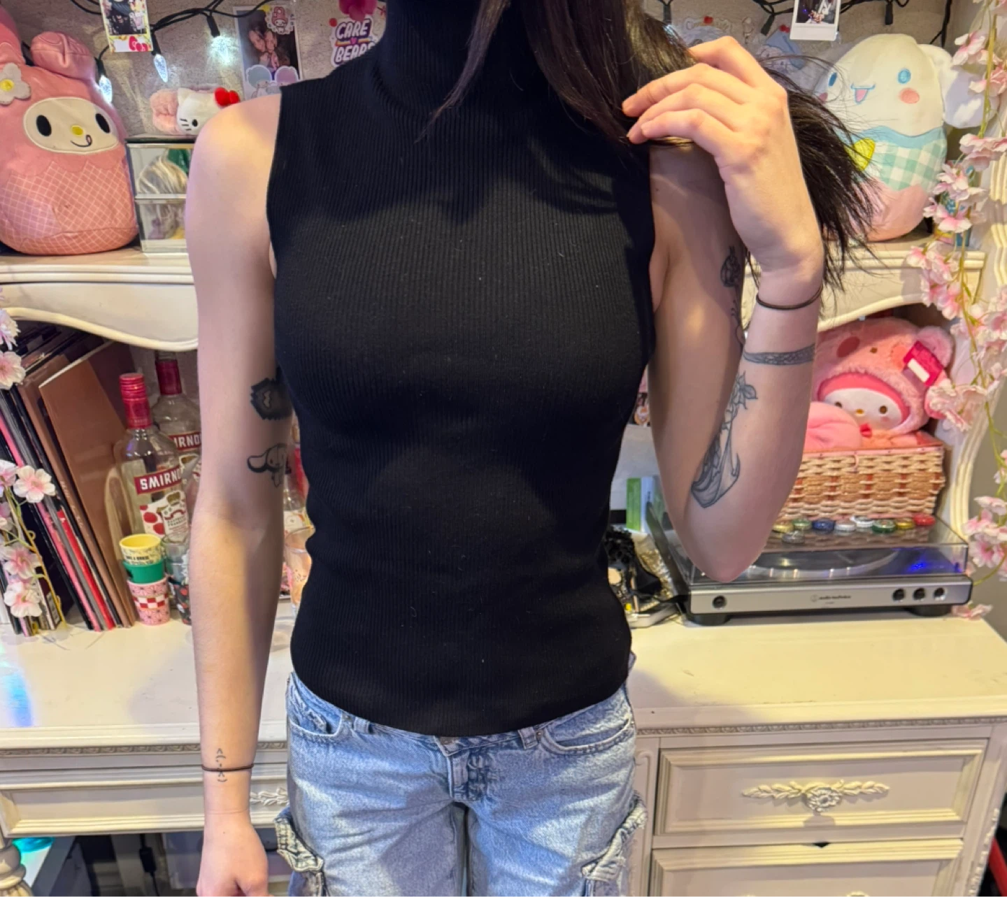Black sleeveless turtleneck top