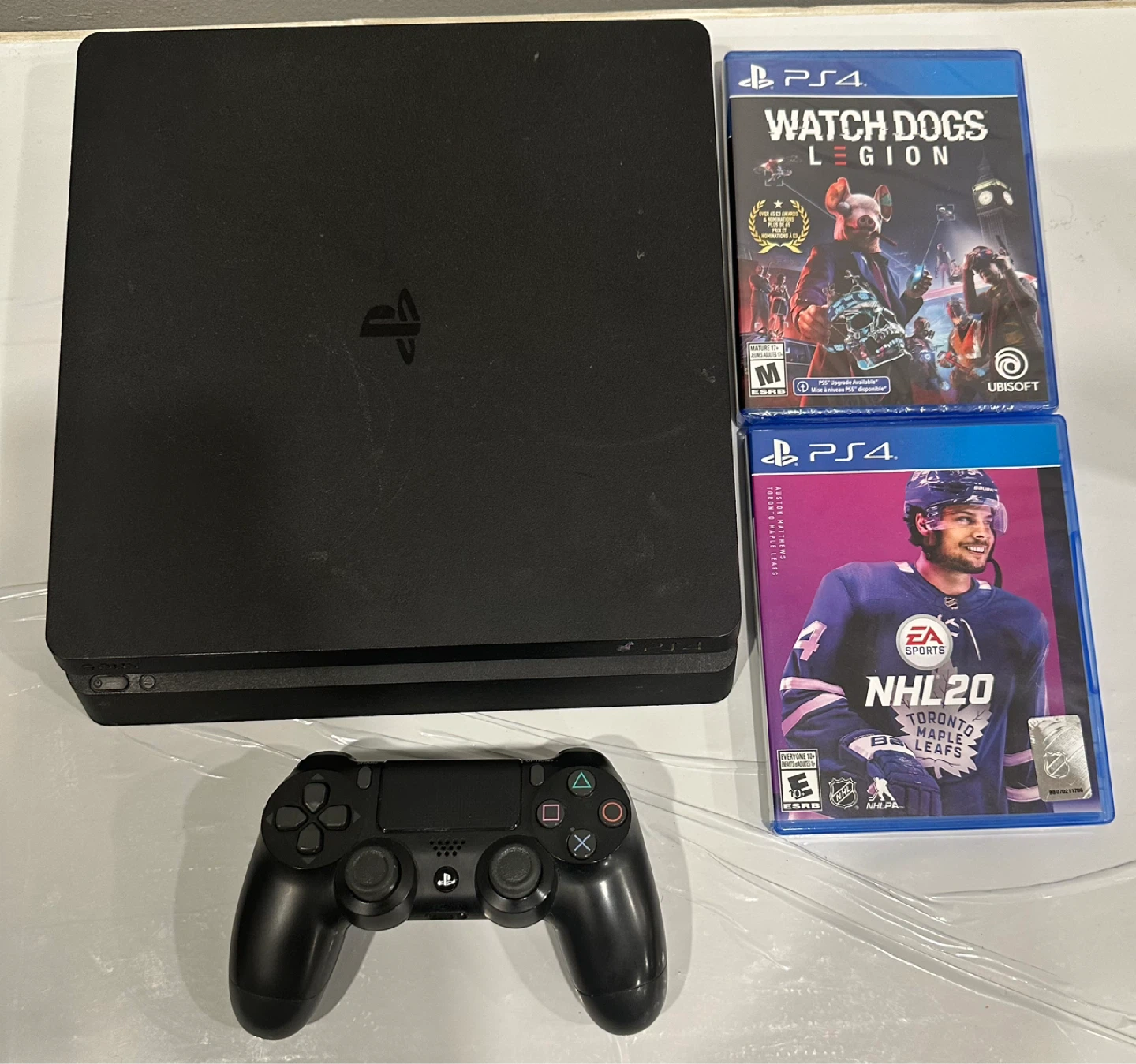 PlayStation 4 Slim Console with Watch Dogs Legion & NHL 20