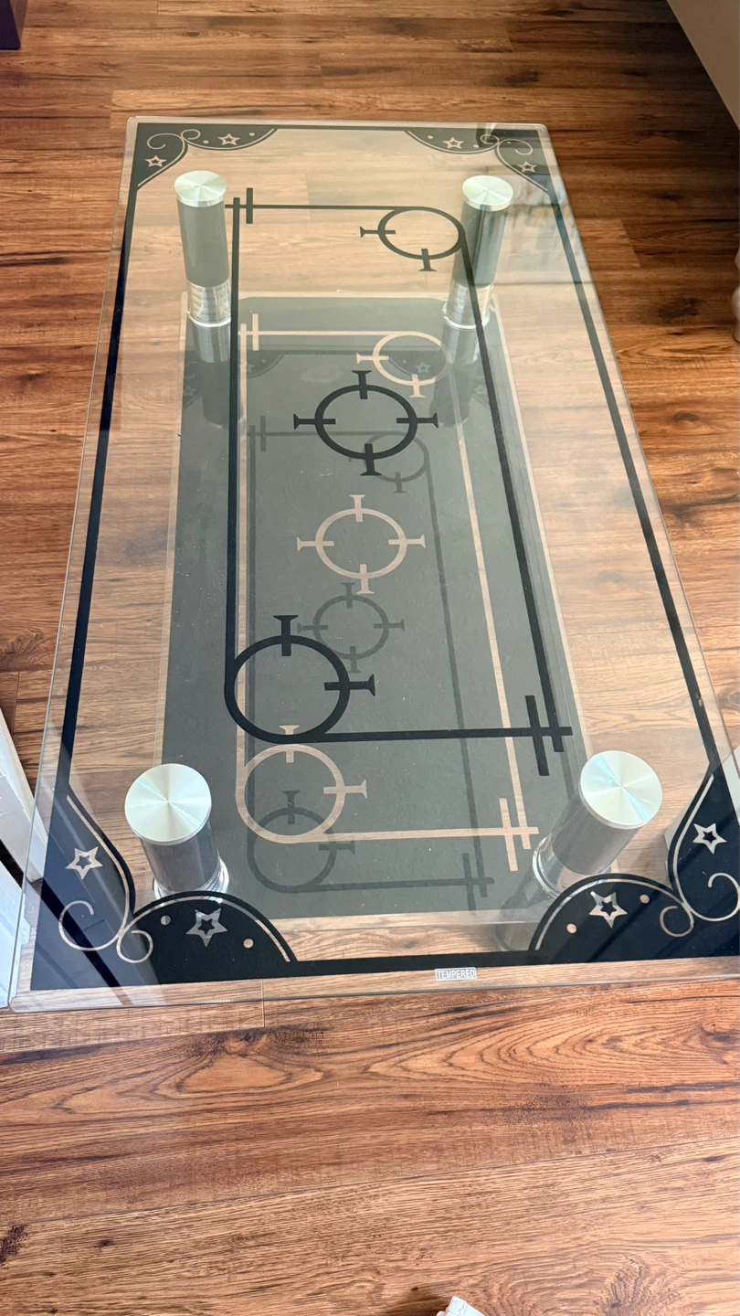 Glass coffee table with decorative accents
