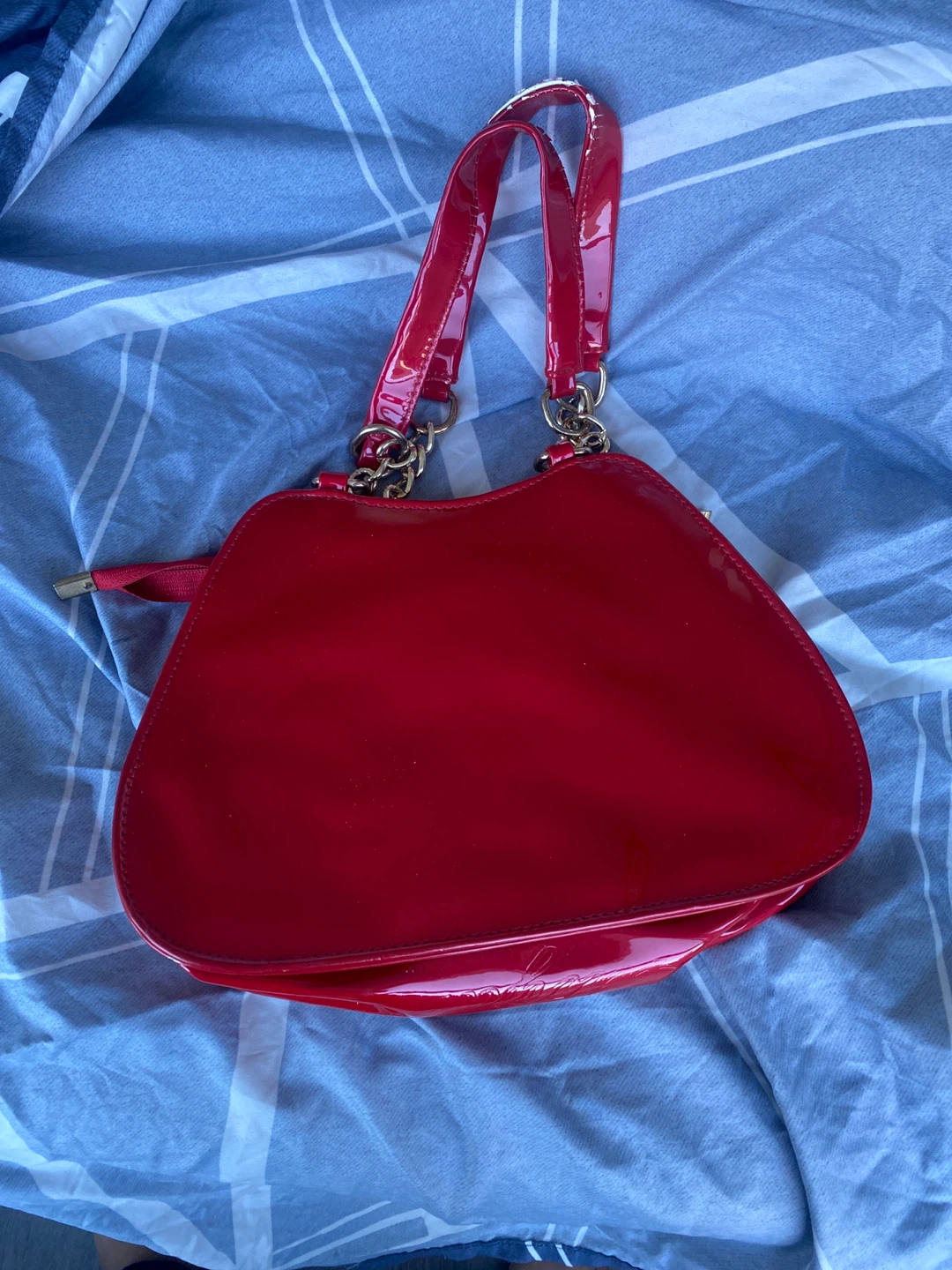 Shiny Red Handbag with Gold Accents
