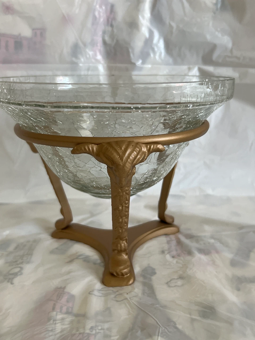 Glass decorative bowl on gold stand