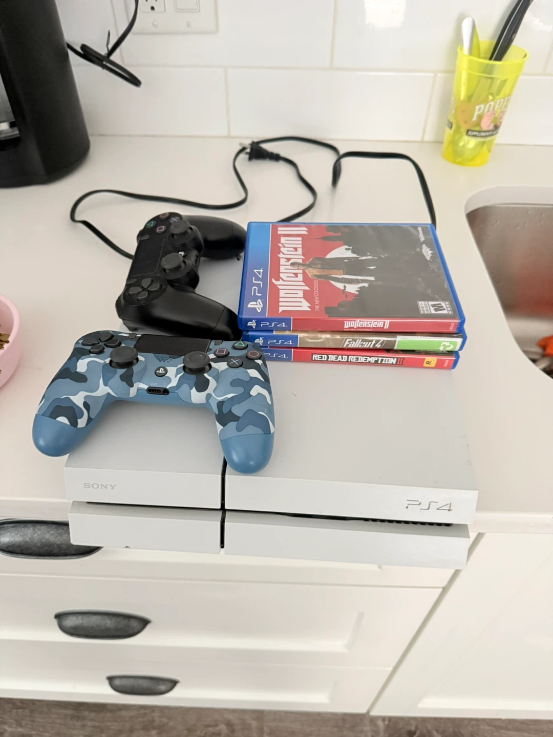 Sony PlayStation 4 with 3 Games and 2 Controllers