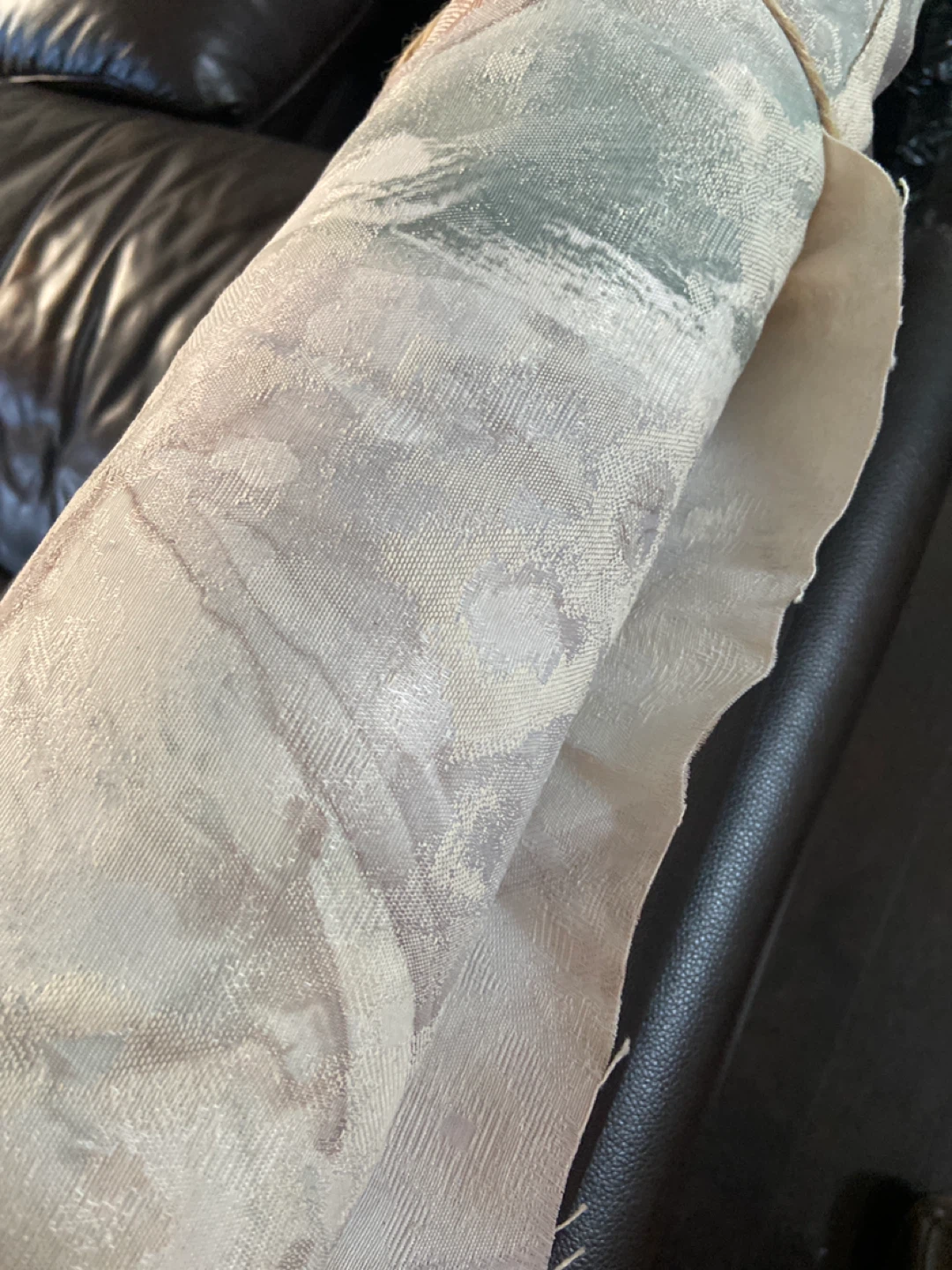 Rolled up tapestry.