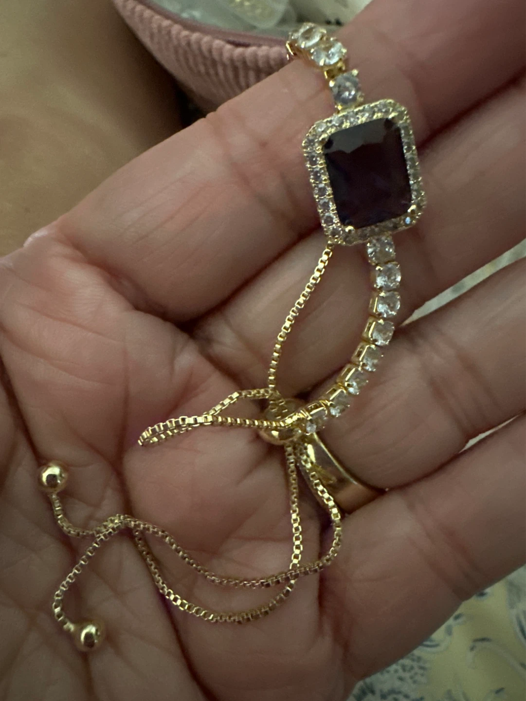 Gold laminated adjustable bracelet with large purple gemstone