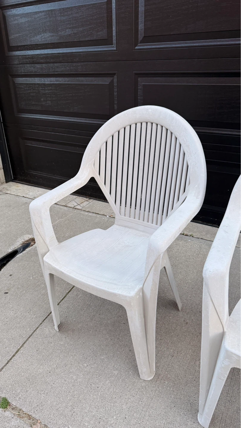 Two White Plastic Patio Chairs