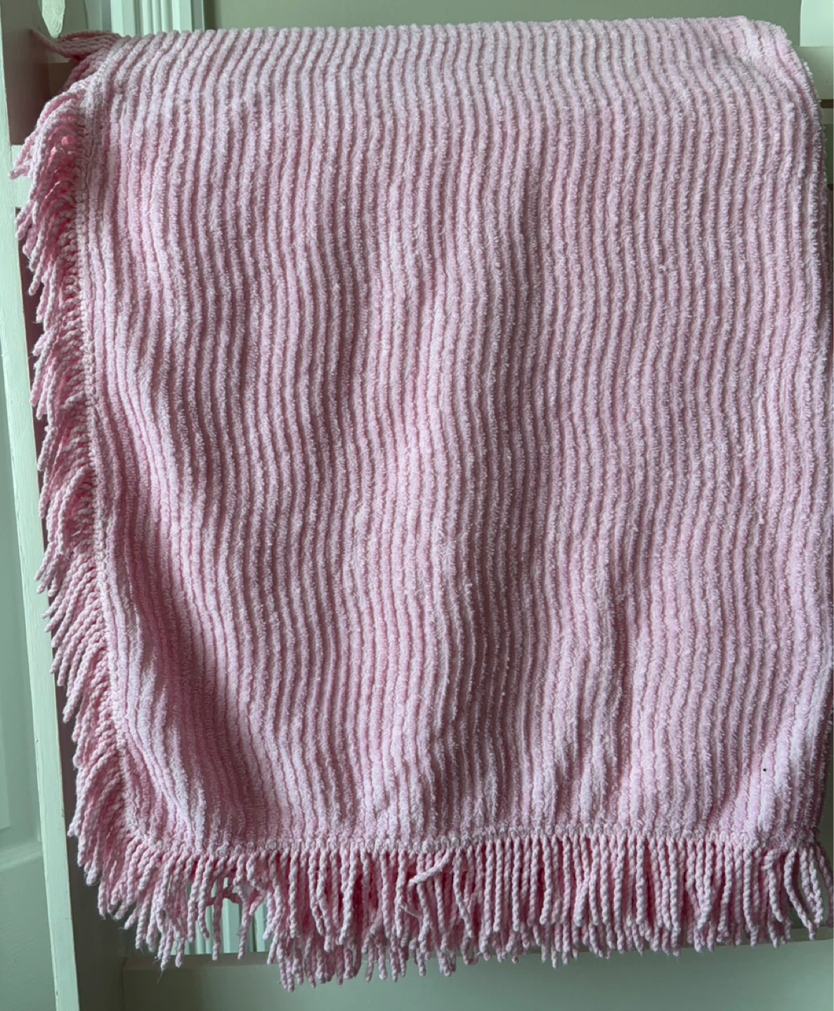 Pink vintage chenille twin bedspread with fringe