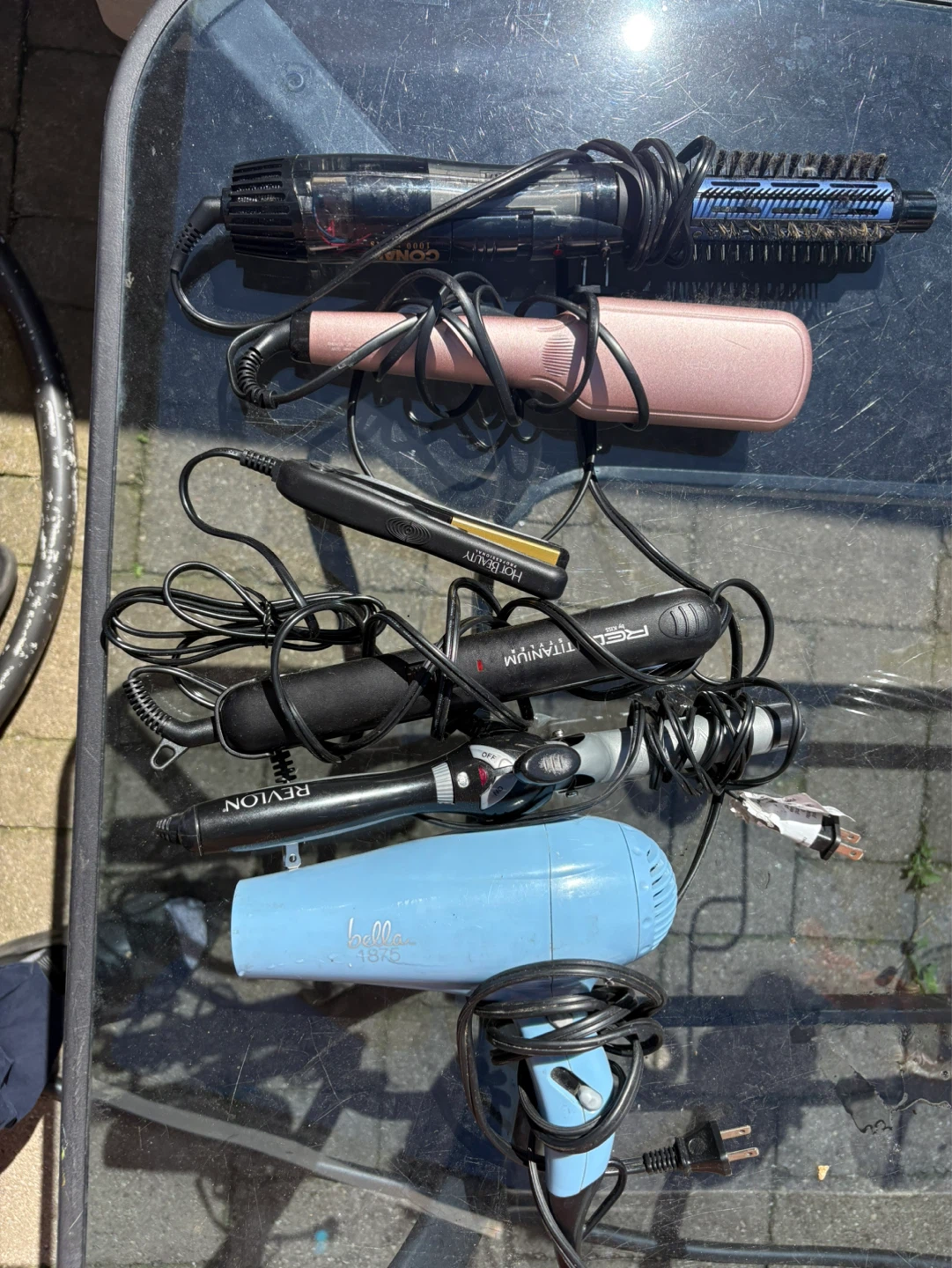 Assorted Hair Styling Tools and Hair Dryer