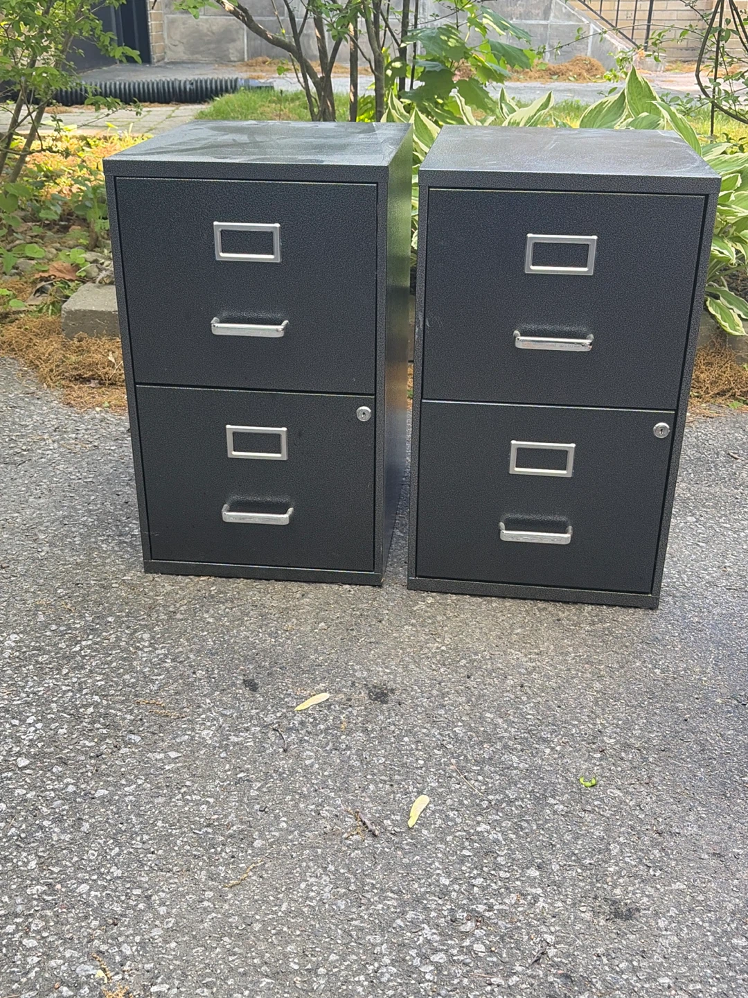 Two dark grey 2-drawer filing cabinets