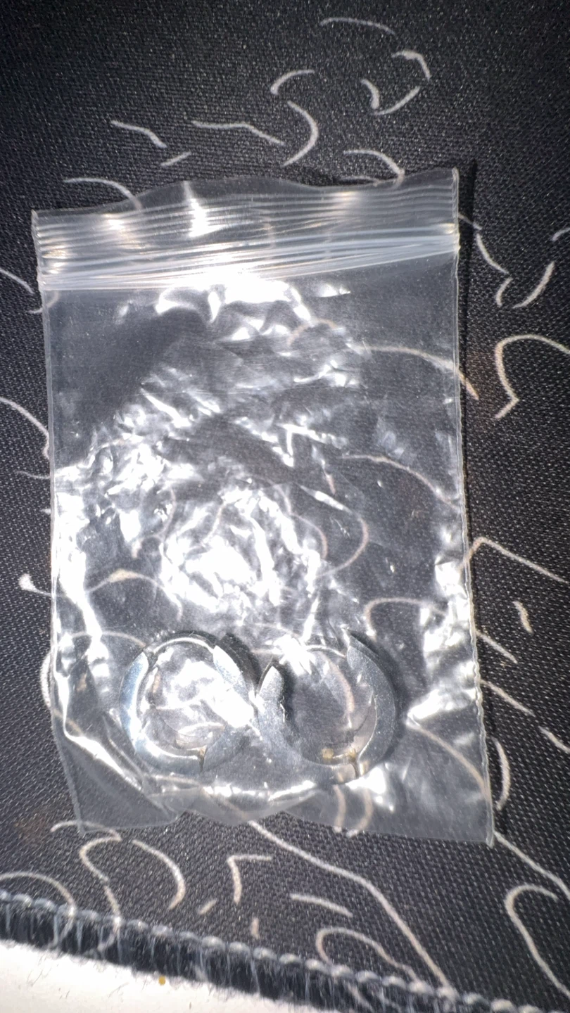 Silver coloured circular clips