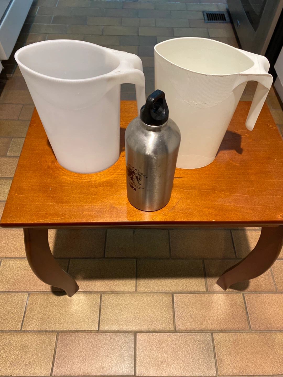 2 Milk Pitchers and Water Bottle
