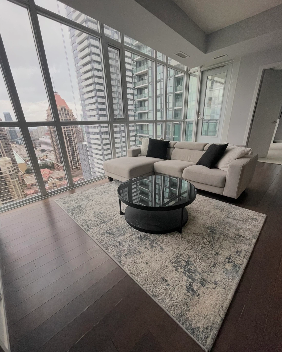 Round Coffee Table with Black Glass Top