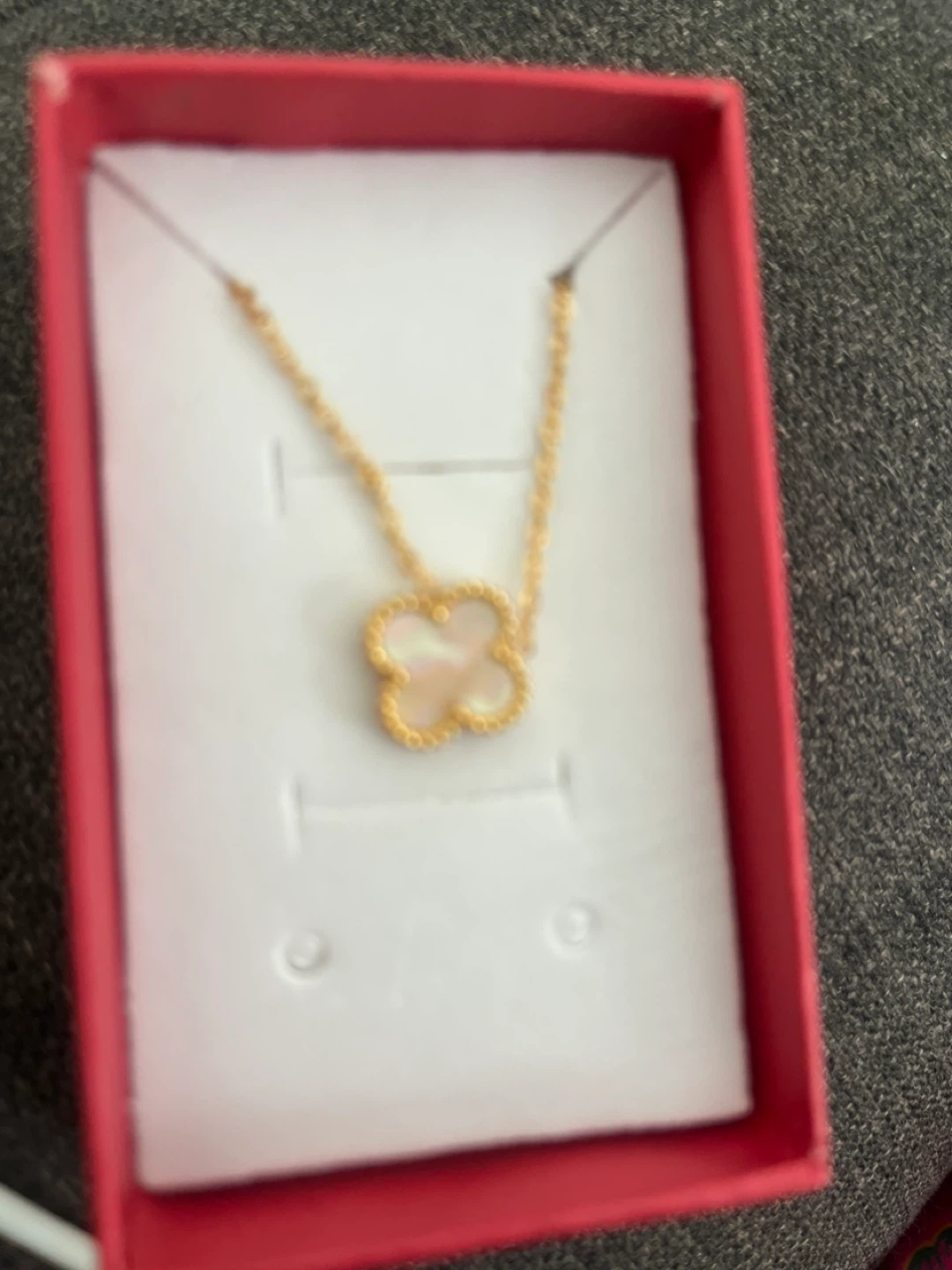 Gold necklace with clover pendant
