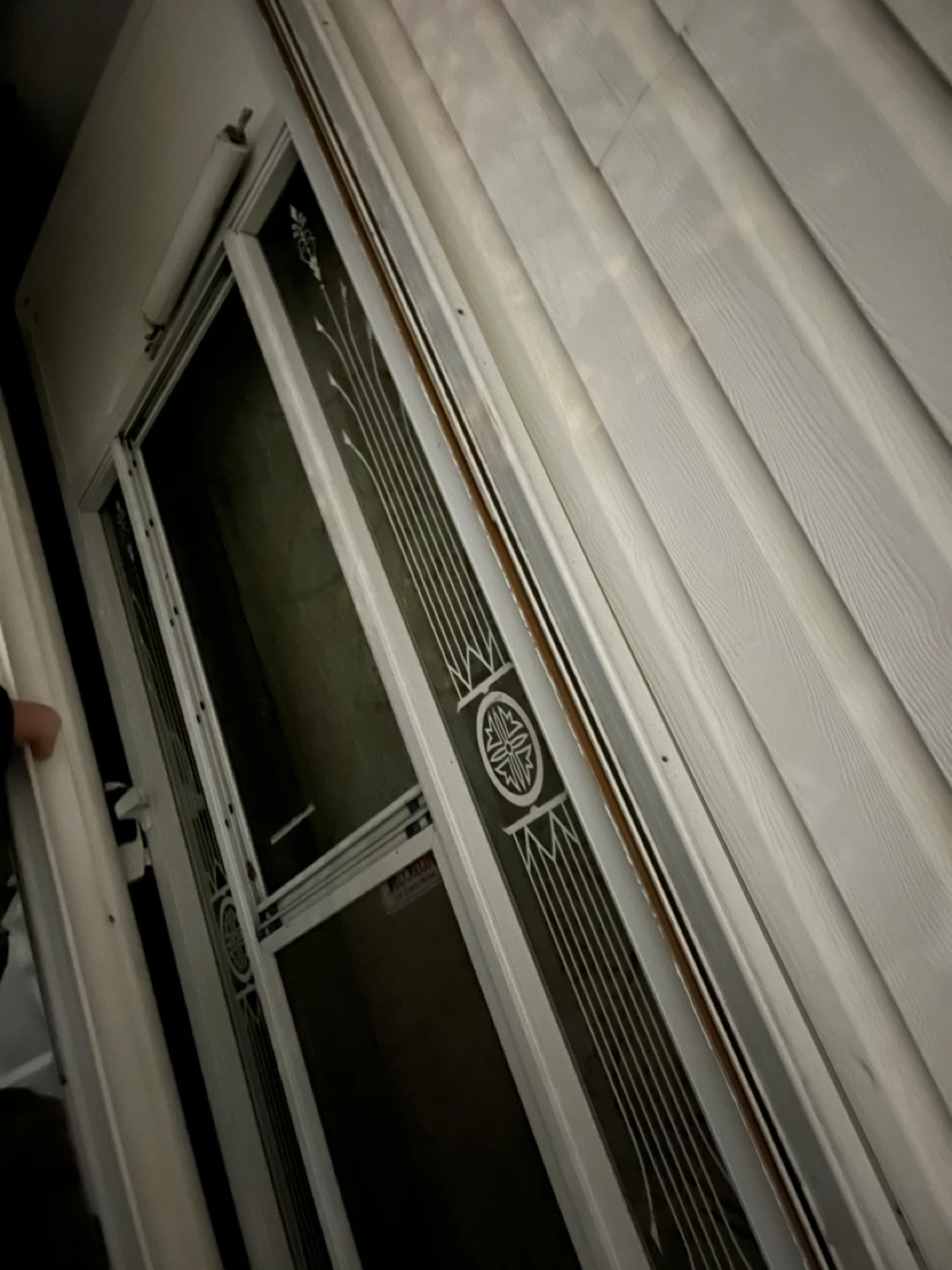Two White Storm Doors with Decorative Panel