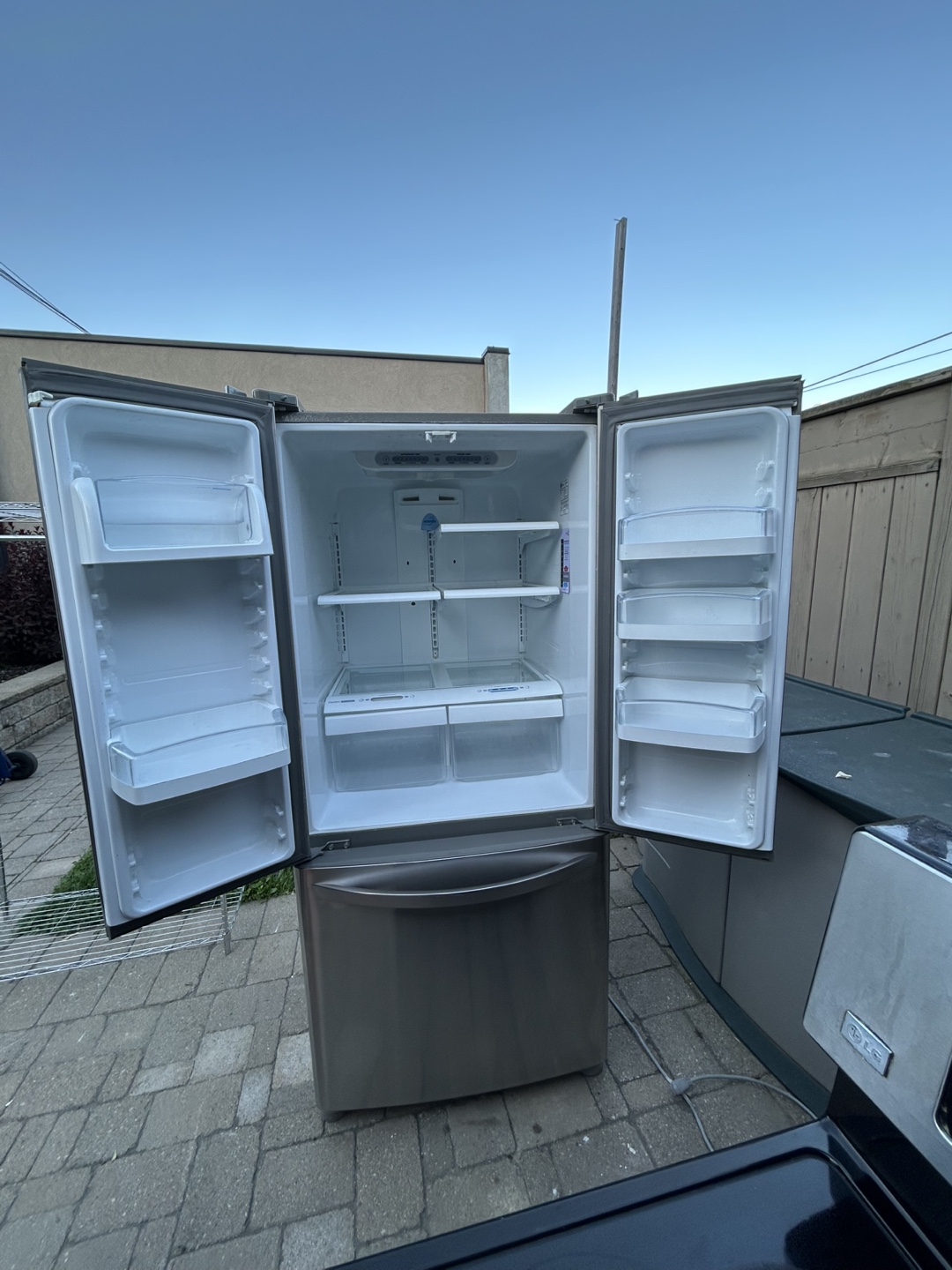 LG Stainless Steel French Door Refrigerator and Glass Top Stove