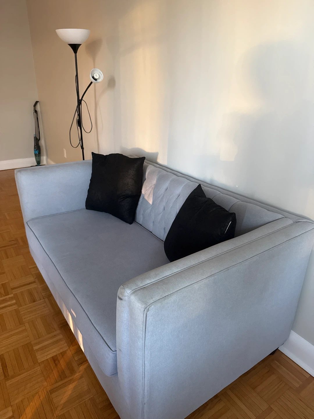 Light Grey Tufted Sofa with Black Pillows - photo 2