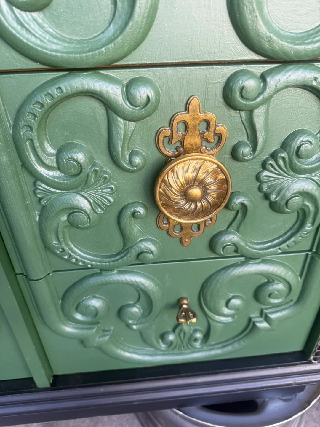 Green Dresser with Ornate Detailing and Floral Linings