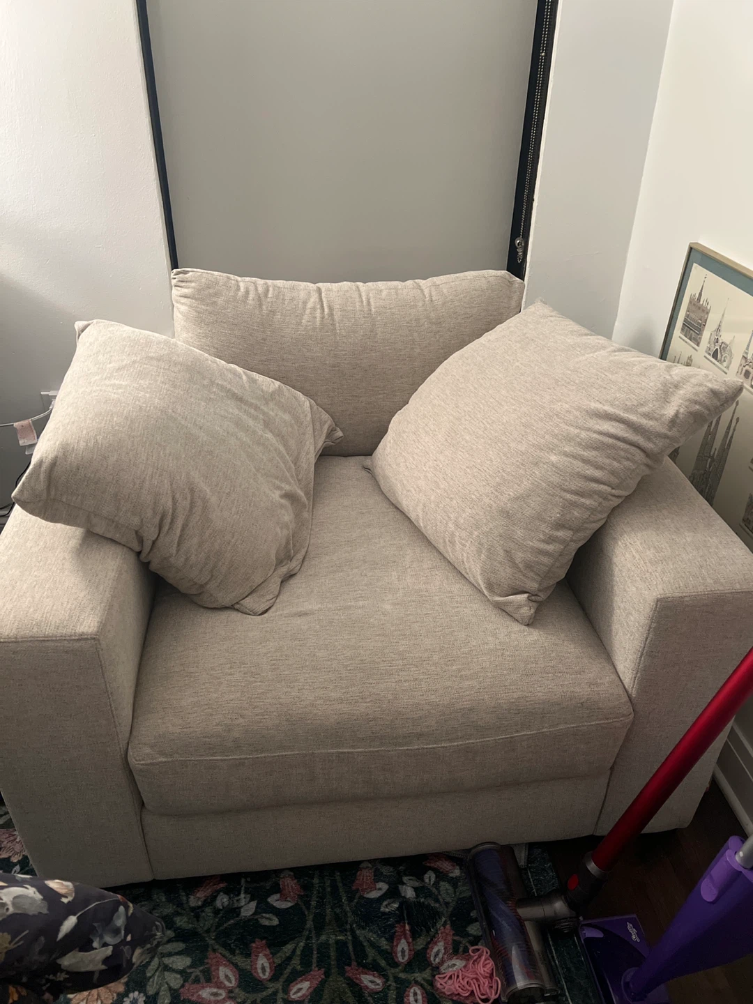 Beige accent chair with pillows