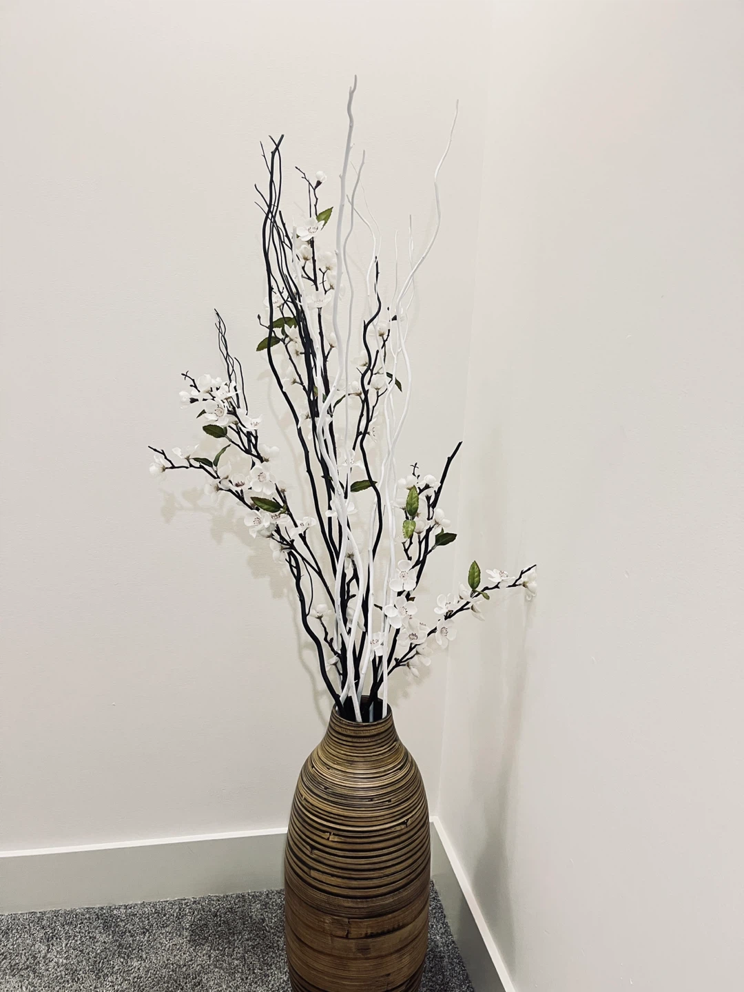 Decorative Branch and Flower Arrangement in Wooden Vase