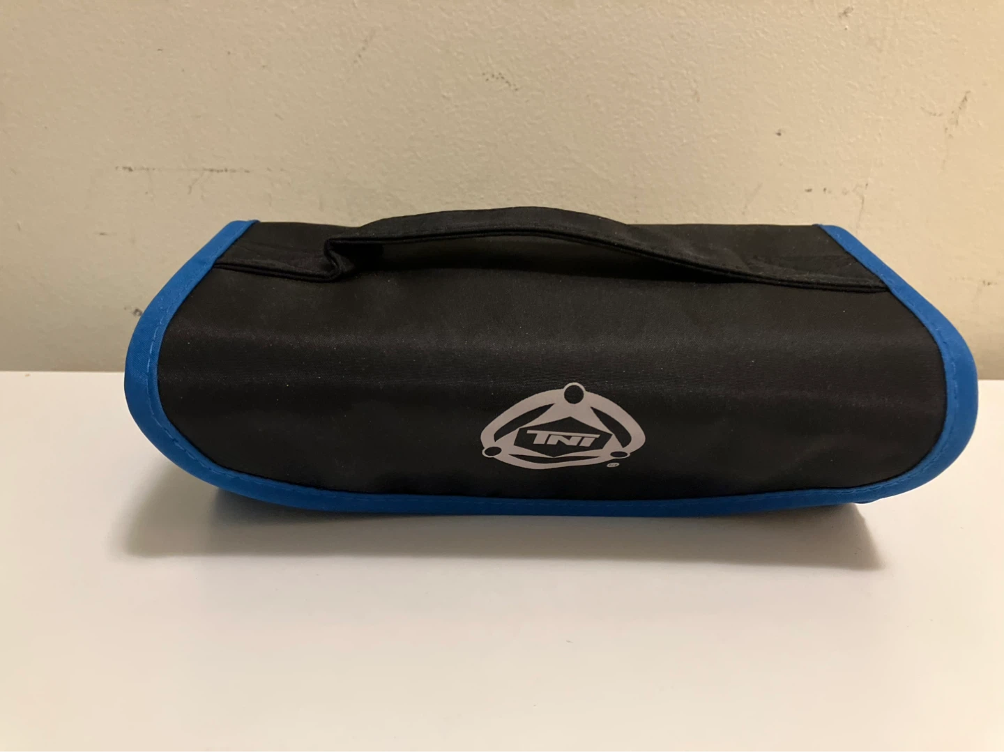 Blue TNT Roll-Up Toiletry Bag