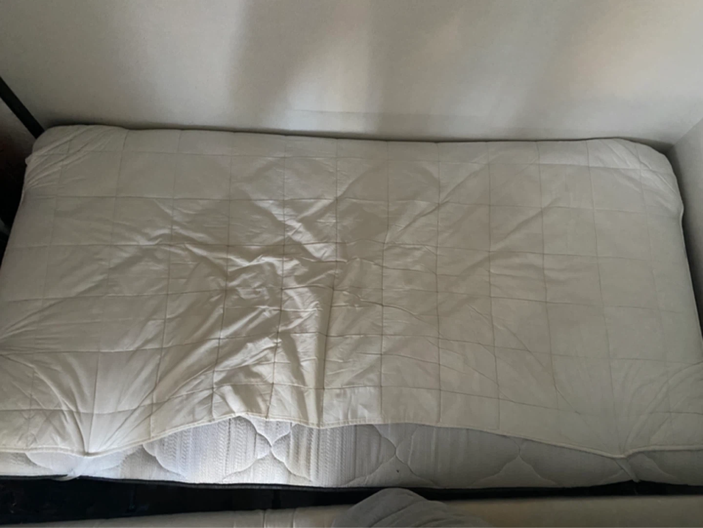 Twin Mattress with Box Spring, mattress cover, and bed frame