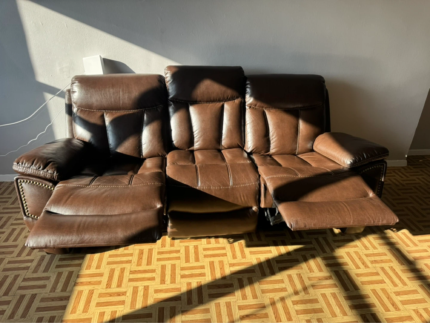 Brown Leather Reclining Sofa