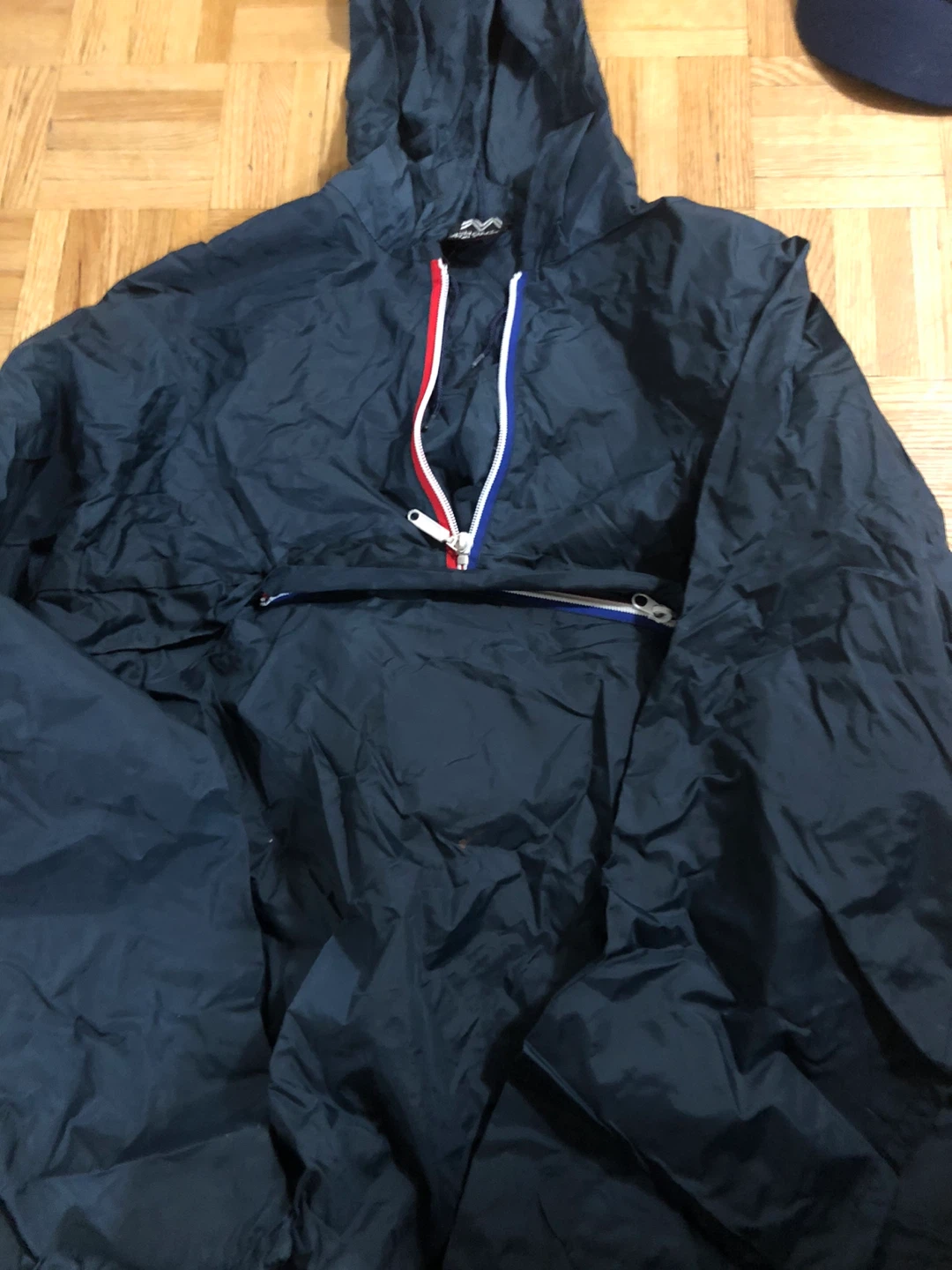 Navy Blue Anorak windbreaker folds into bag