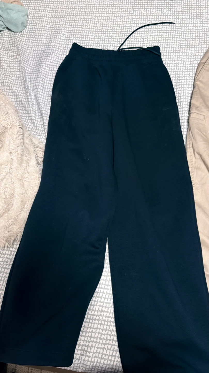 Uniqlo sweatpants and beige jeans