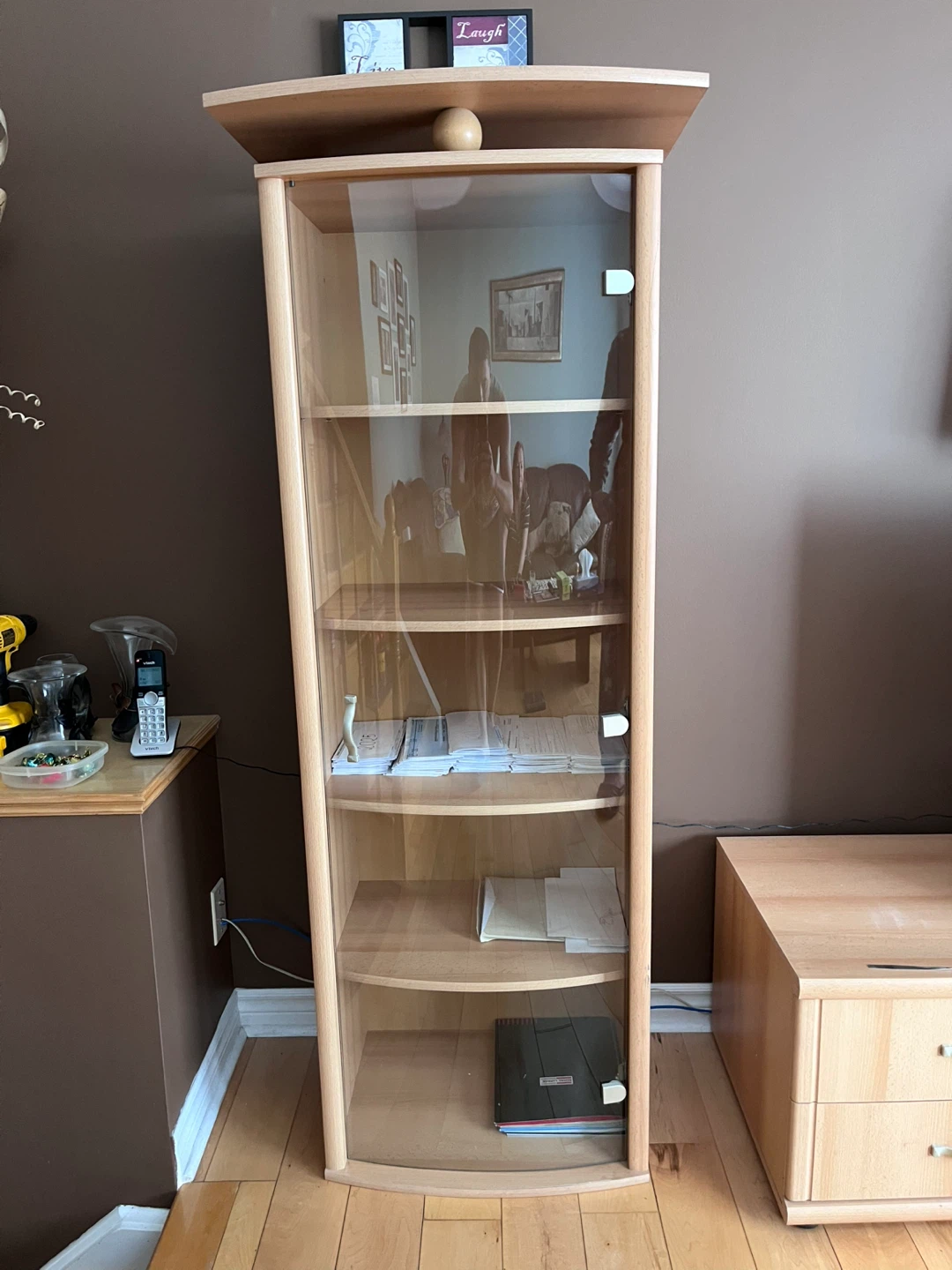 Tall display cabinet with glass door