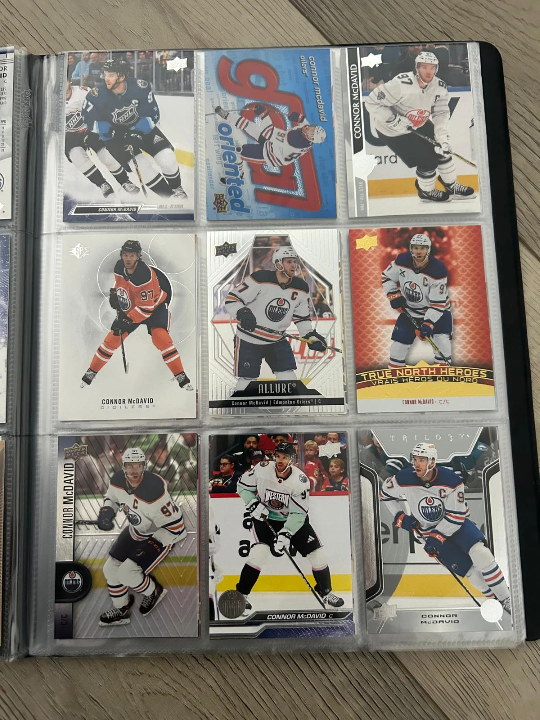 Connor McDavid hockey card collection in binder - photo 4
