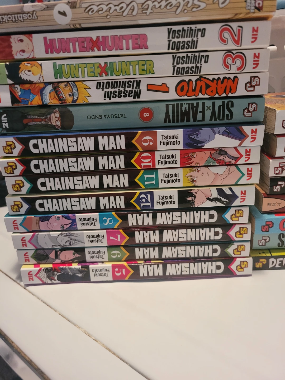 Japaneze comics books including Chainsaw Man Manga Volumes 5-12