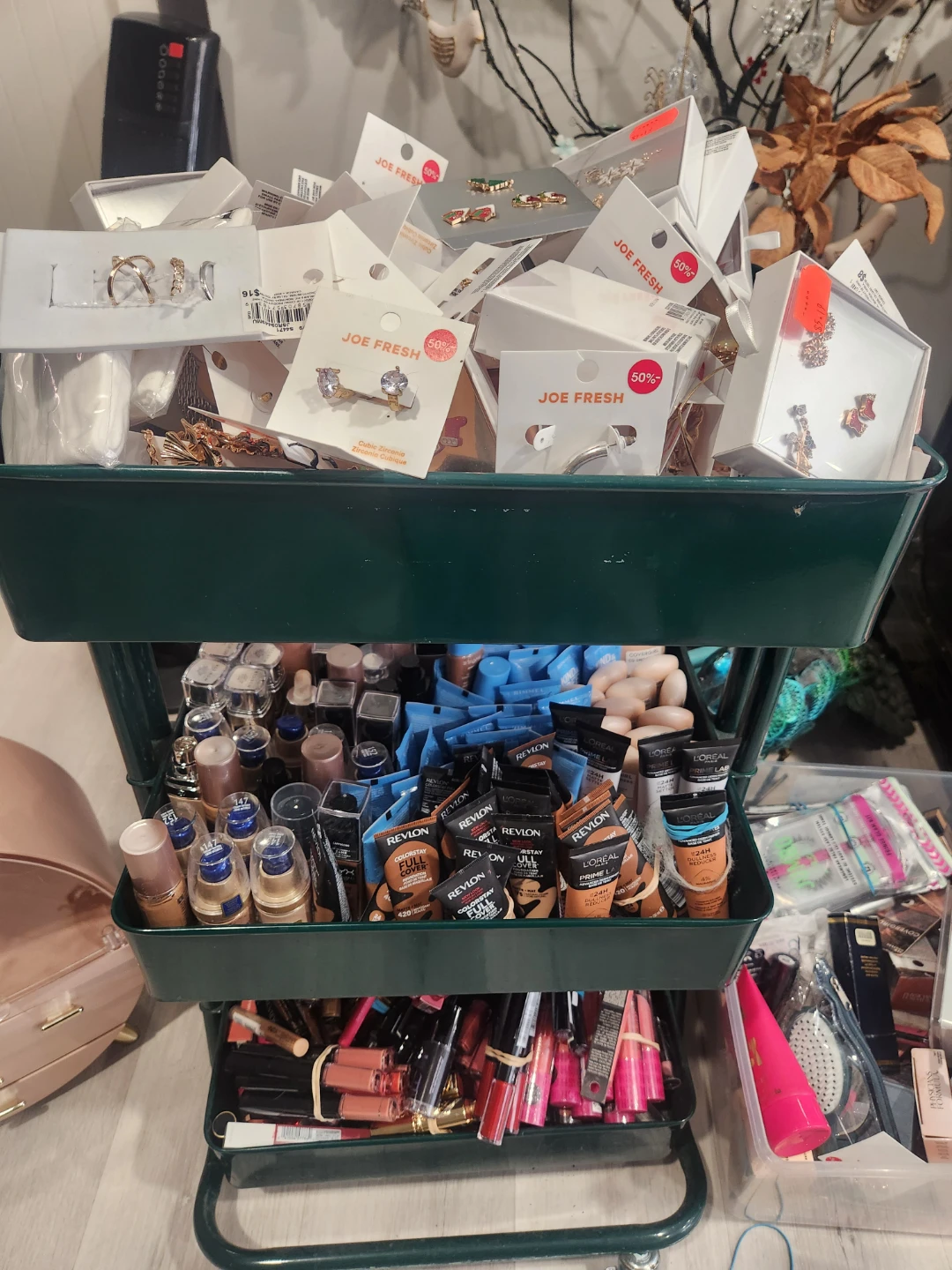 Assorted Makeup Palettes, Foundations, and Lipsticks