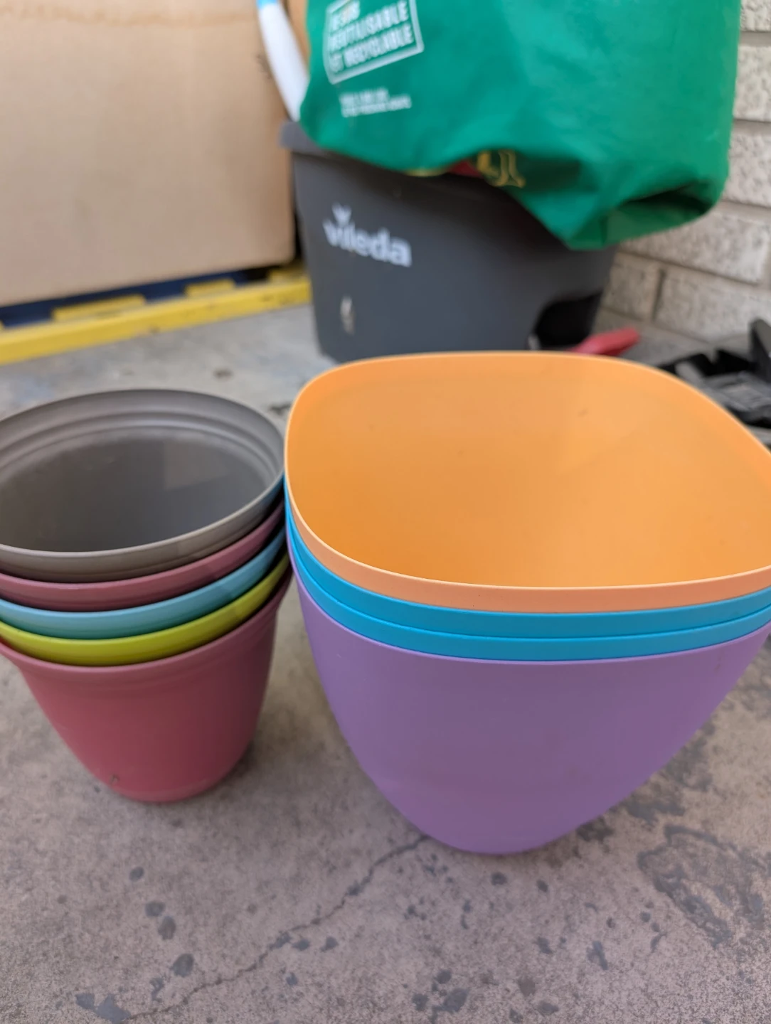 Set of 9 colourful plastic plant pots