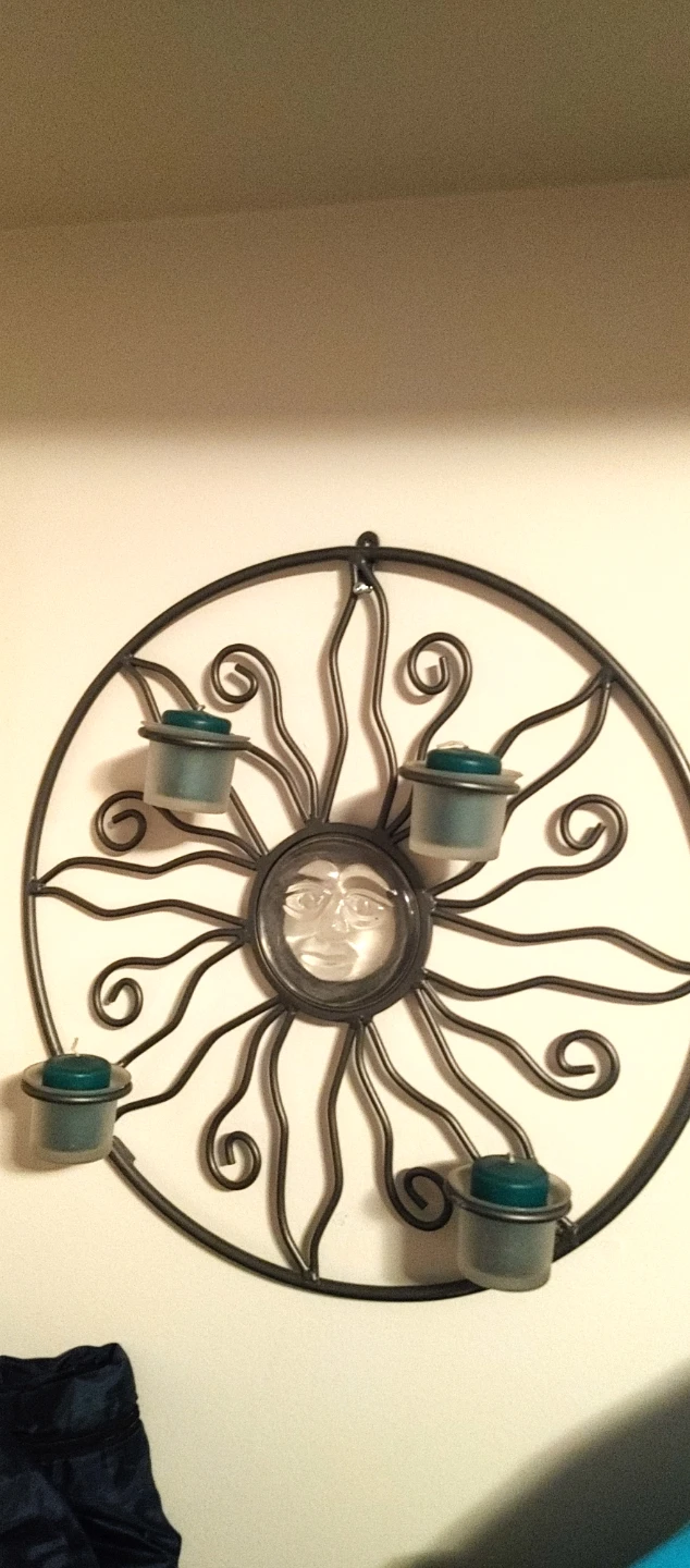 Sun face wall candle holder