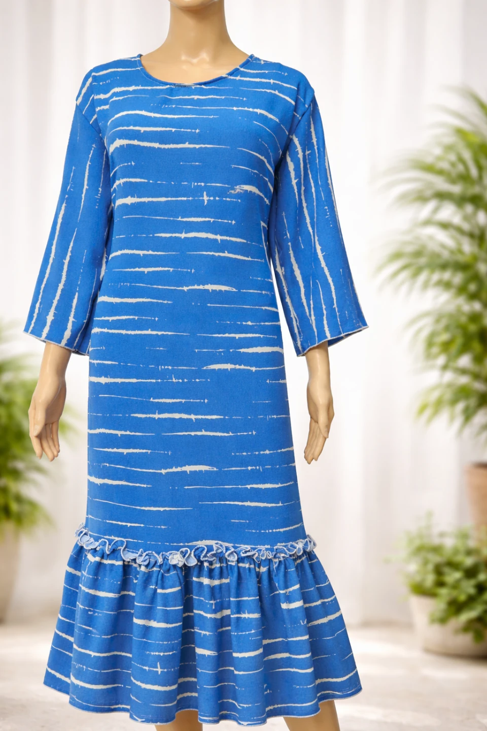 Blue patterned dress with ruffles