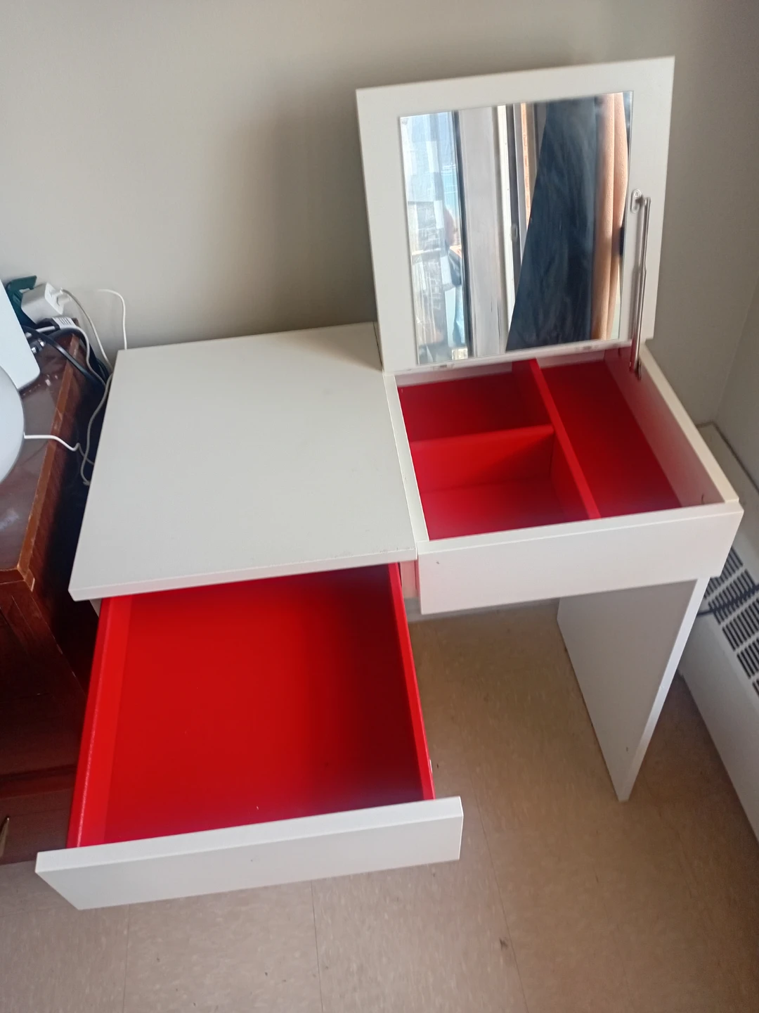 White vanity desk with mirror and red interior