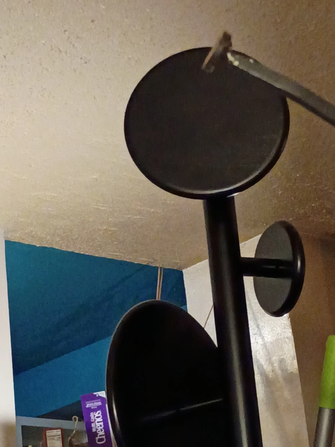 Tall black wooden coat rack
