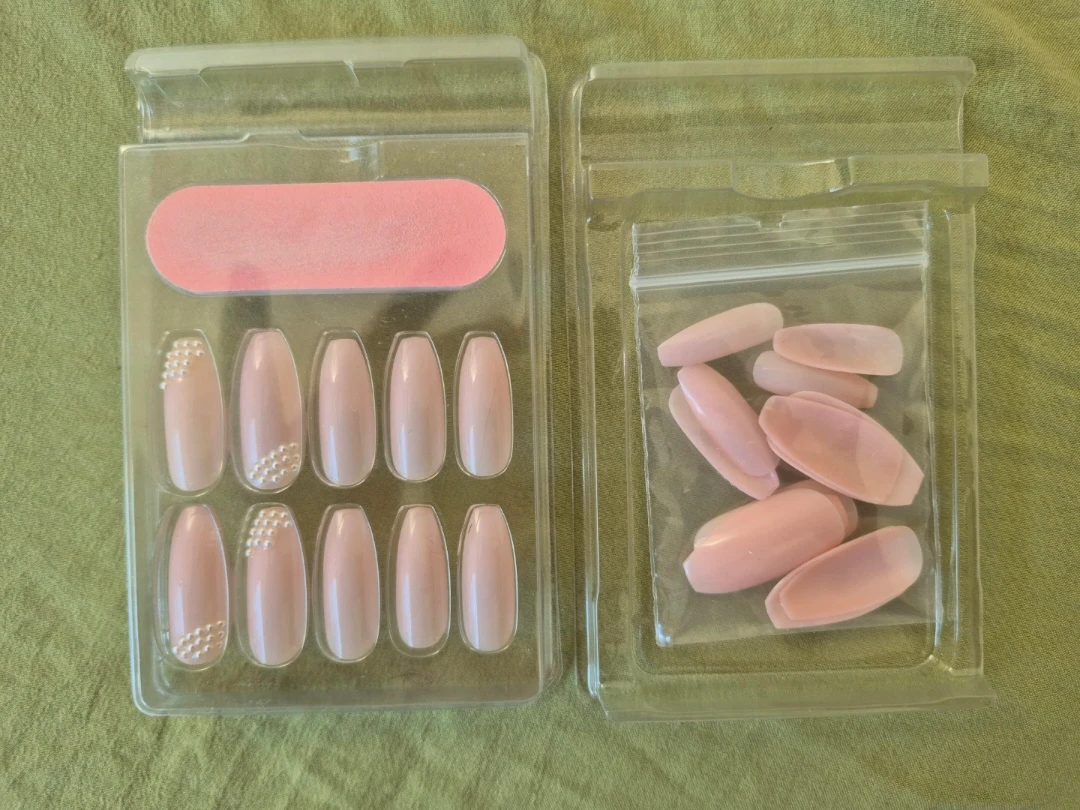 Pink nails with pearls on it