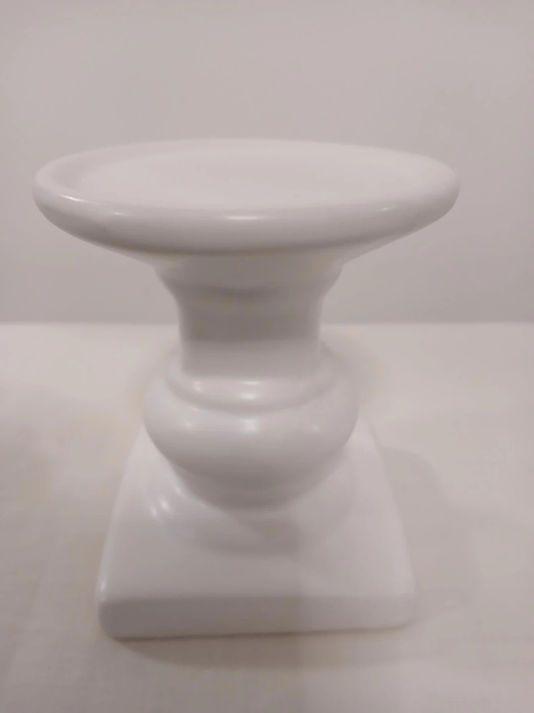 White Pedestal Candle Holder. Pick up only.