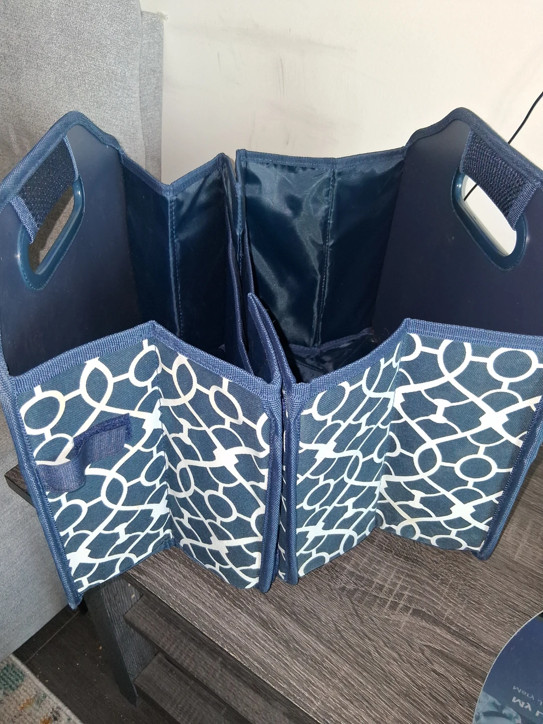 Blue fabric organizer tote with white geometric pattern
