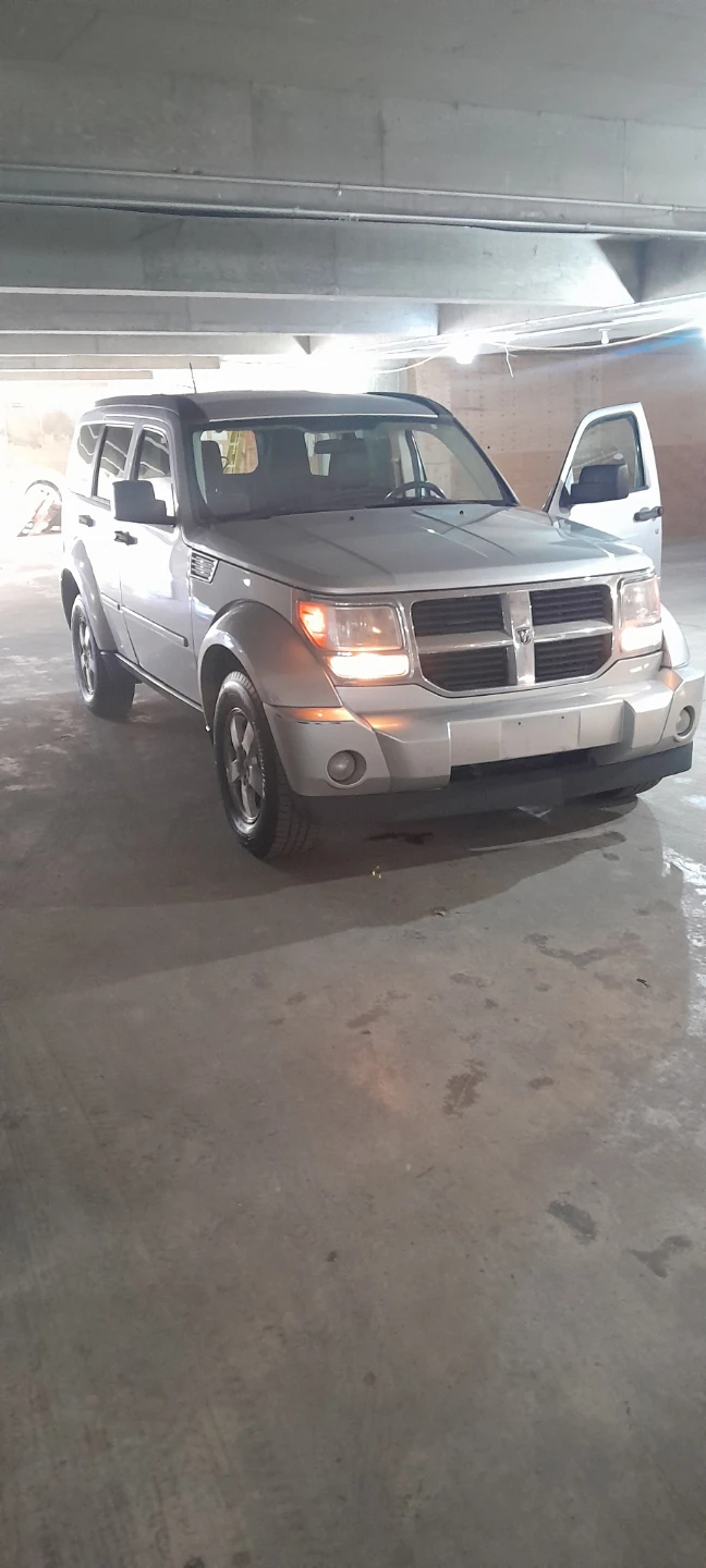 Silver Dodge Nitro SUV - photo 2