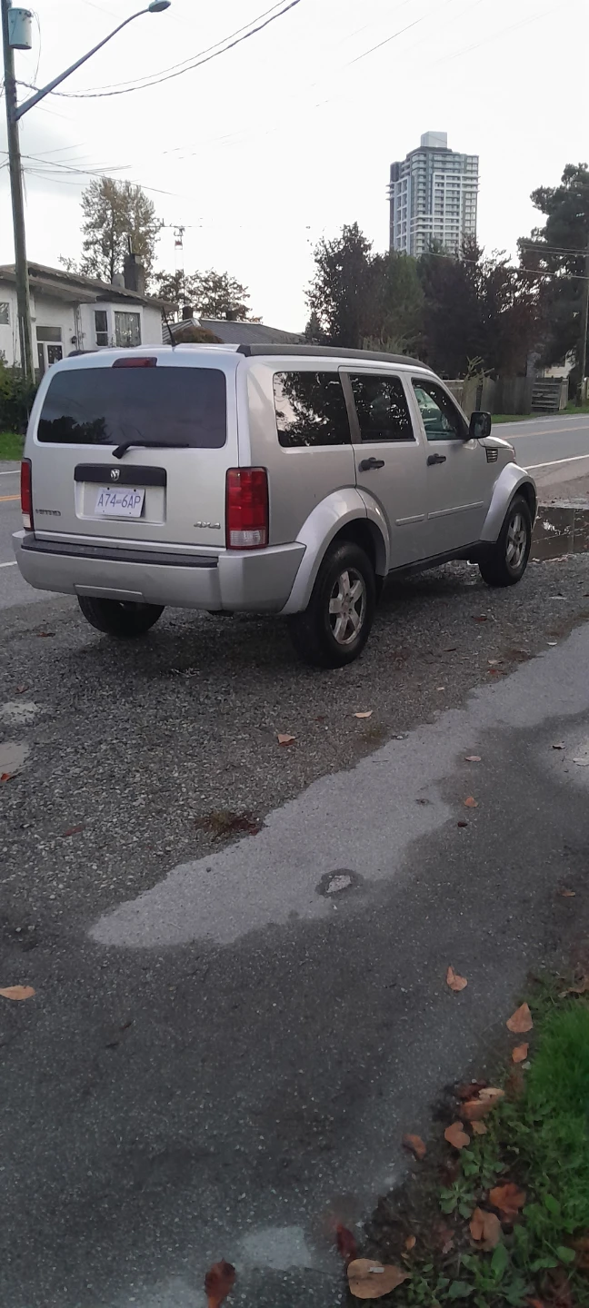 Silver Dodge Nitro SUV - photo 3