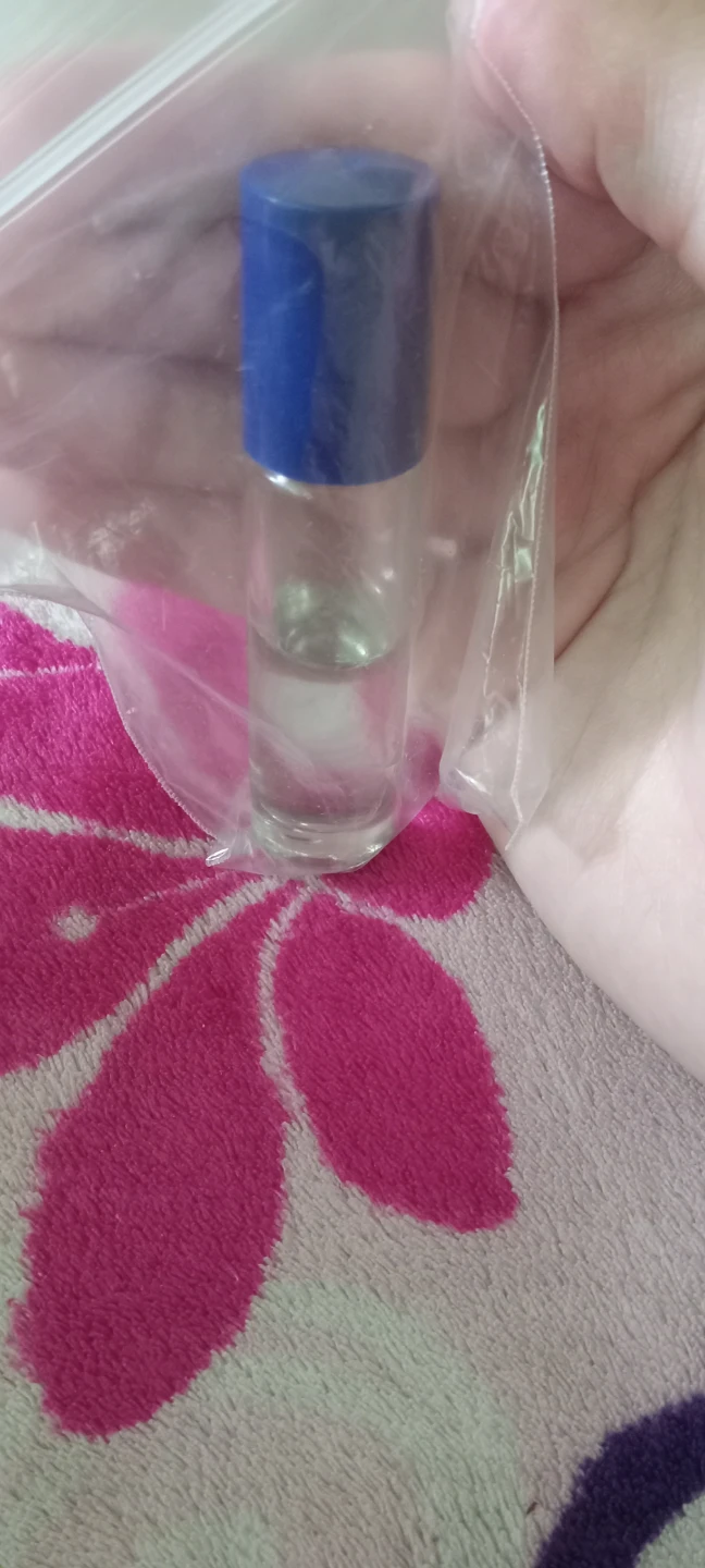 Small glass perfume roller bottle