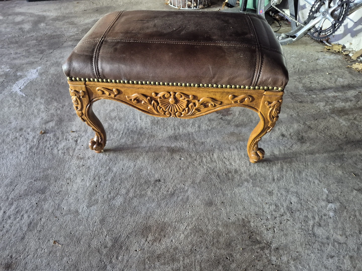 Brown Leather Tufted Ottoman with Carved Wood Legs