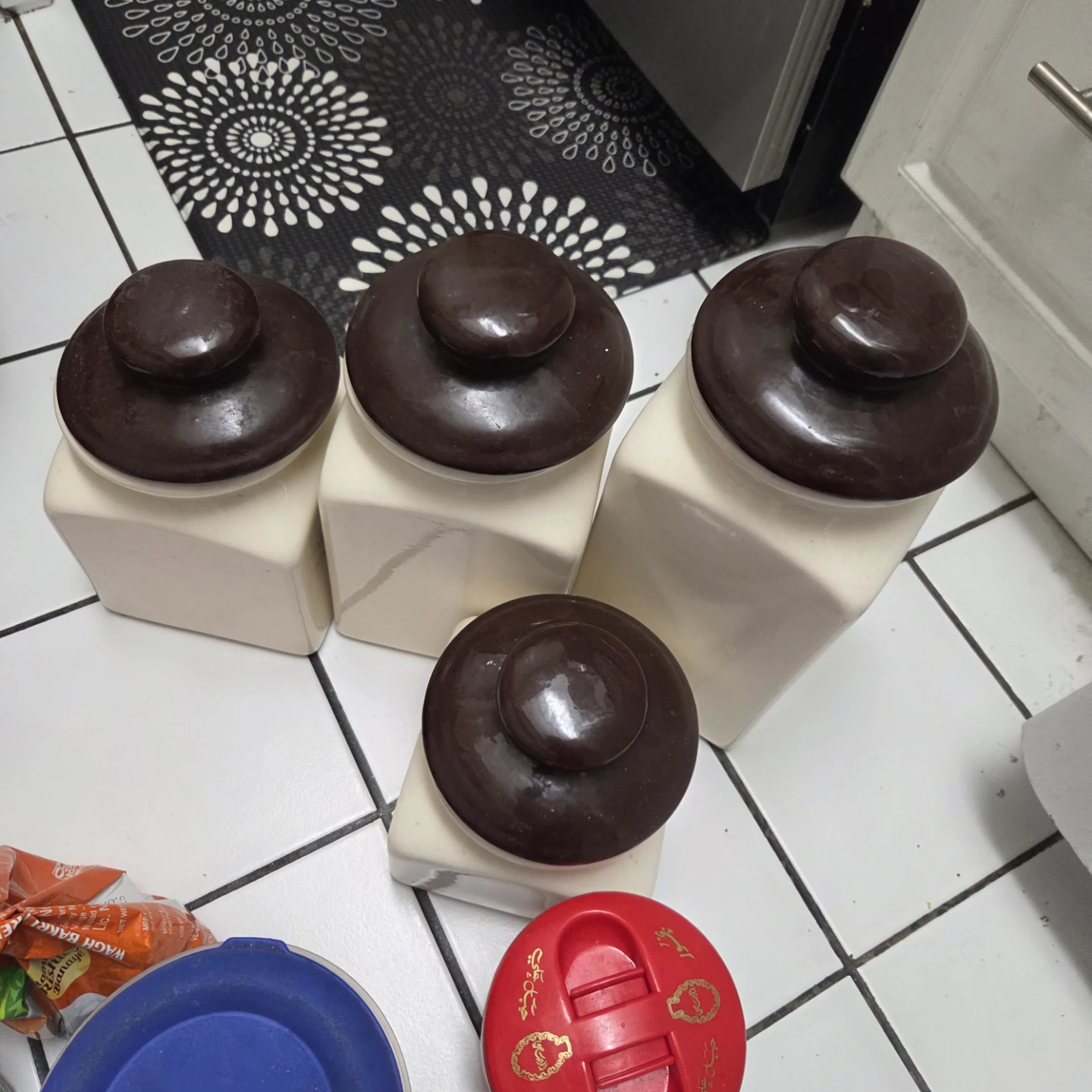 Set of 4 Ceramic Canisters with Floral Design